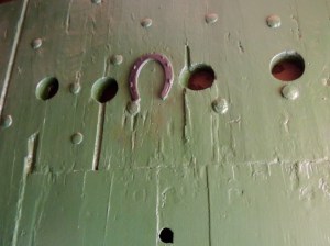 Upside down horseshoe on the door to the torture chamber to let you know your luck is running out.