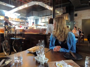 Julia watching the magic happen in the kitchen