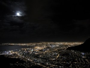 The moon peaking out from the clouds
