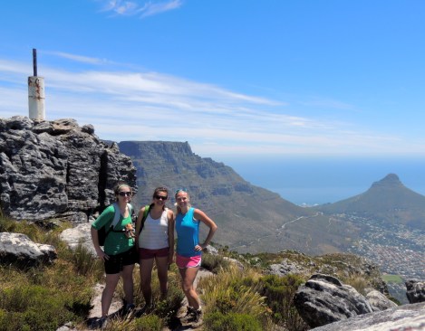 Emily, Thea, and me on top of Devil's Peak with Table Mountain and Lion's Head in the back!