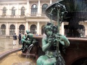 Considering the fountain has someone with a ring of roses, not so well (look into the folklore behind the ring around the rosie nursery rhyme - it's about people dying. Sorry to your childhood).