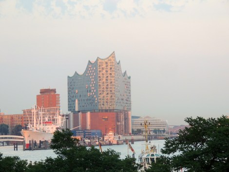 Icecube building - it's actually a new opera house - at sunset. It has cost taxpayers way more than initially planned, partly due to the fact that it requires special glass so as not to affect the ships through reflections when they are coming in... a lot of this glass was broken during construction by some careless workers, so had to be replaced.
