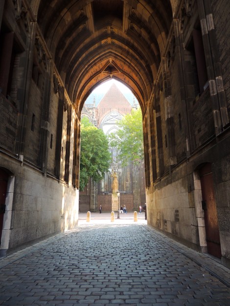 Walking through the tower to the square where the nave used to stand, with a view of the current cathedral.